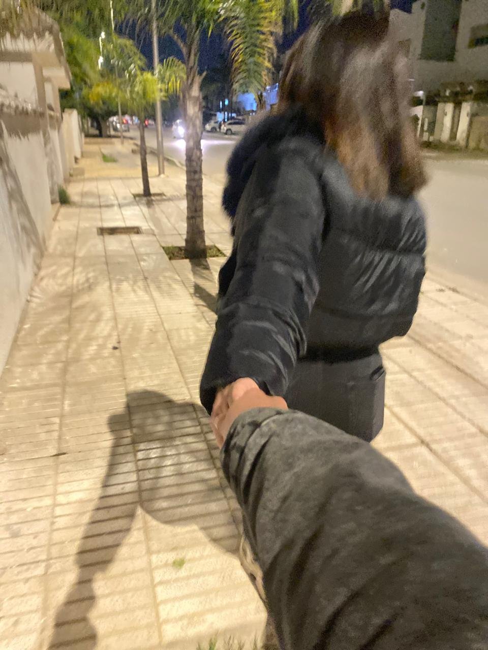 Walking hand in hand at night