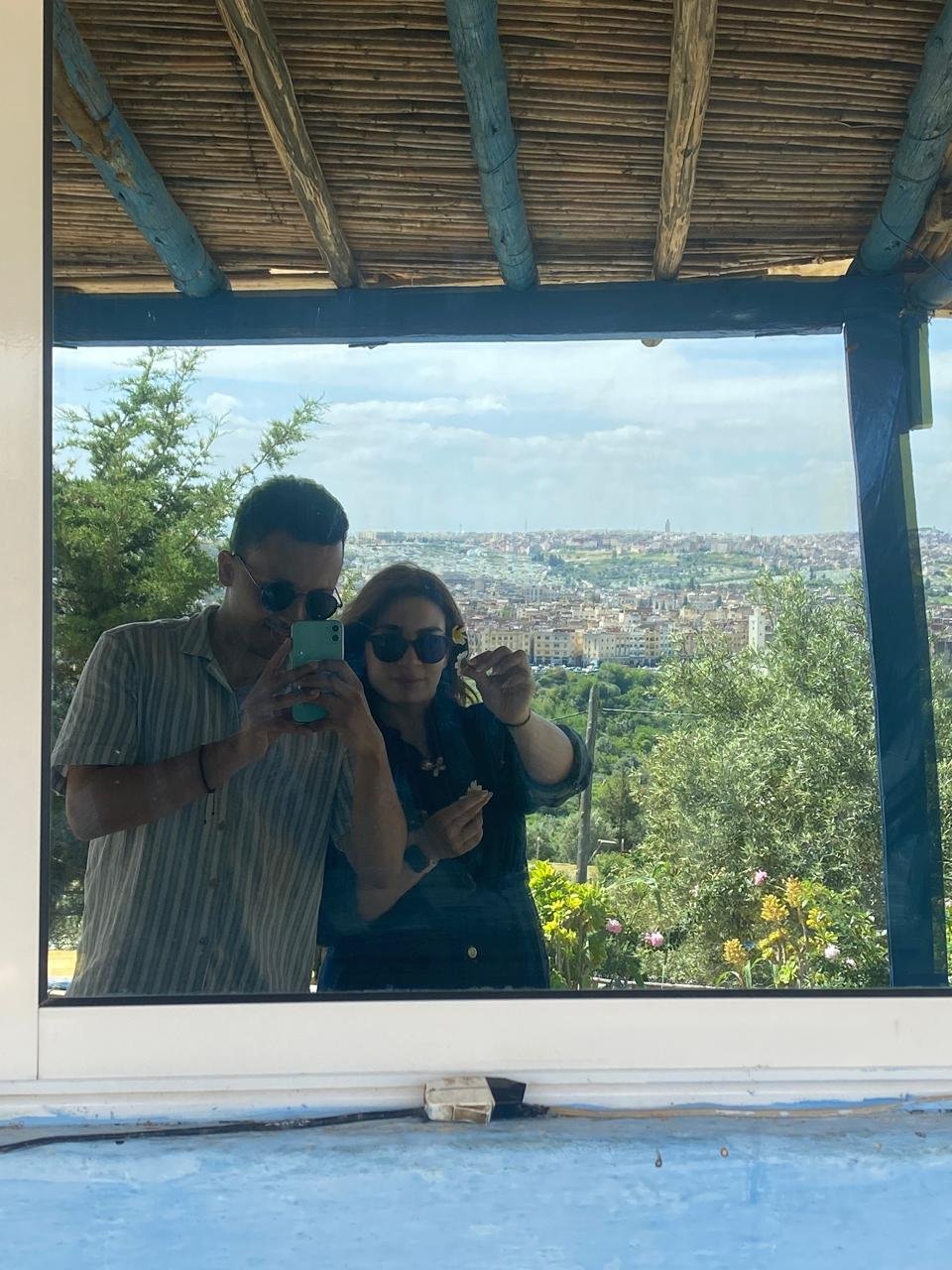 Mirror selfie with city view